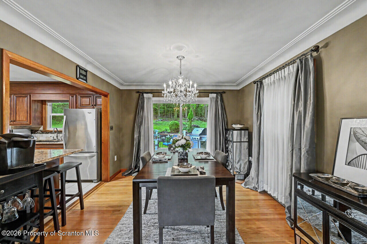 121 T Rt 351 Moscow, PA 18444 - Photo 18 of 79 a view of a dining room with furniture window and wooden floor