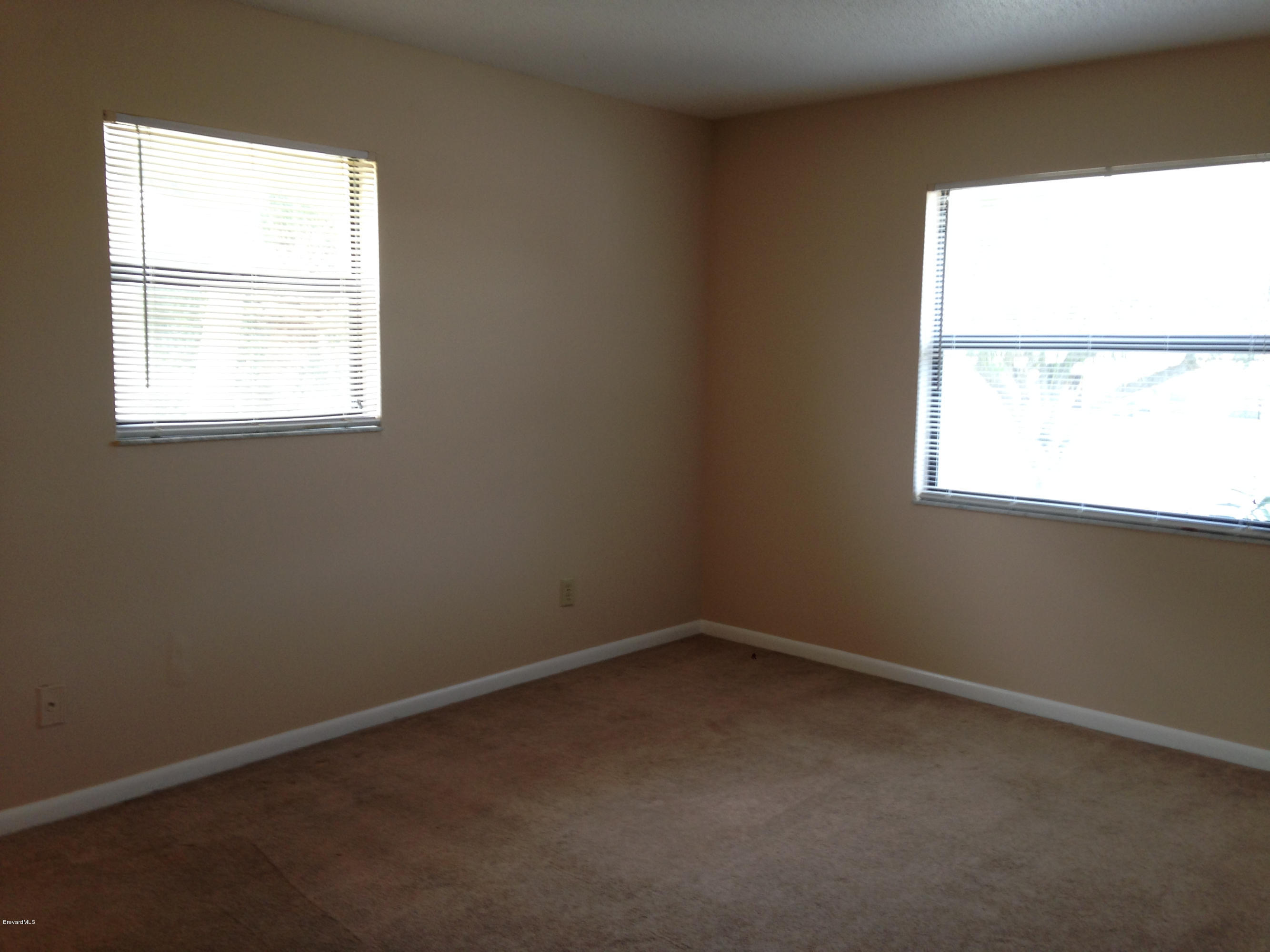 592 North Wickham Road, Unit 10 Melbourne, FL 32935 - Photo 12 of 15 Master Bedroom