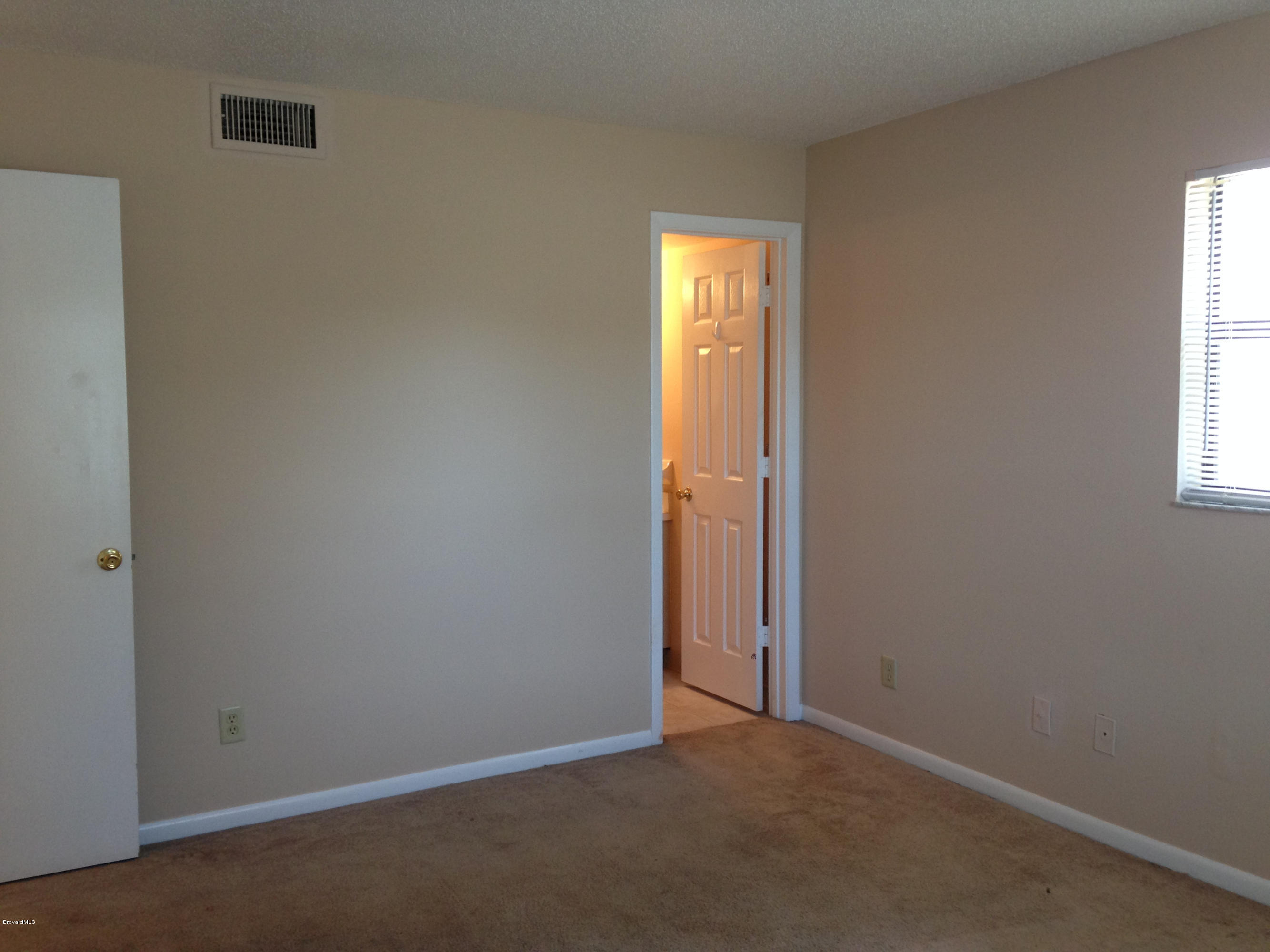 592 North Wickham Road, Unit 10 Melbourne, FL 32935 - Photo 13 of 15 Master Bedroom