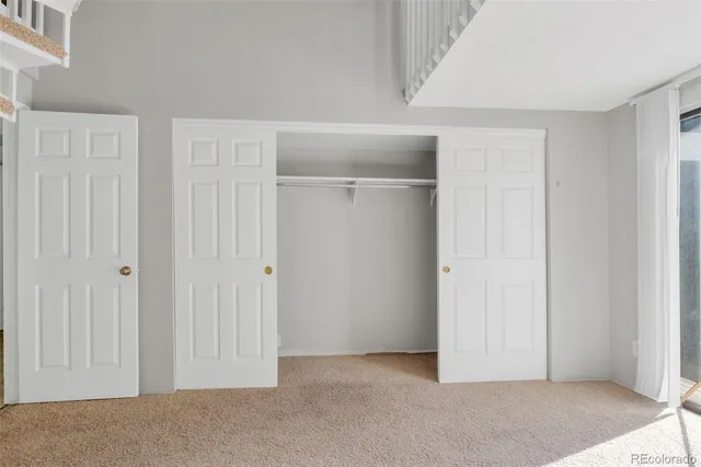 an entryway and a room with stairs