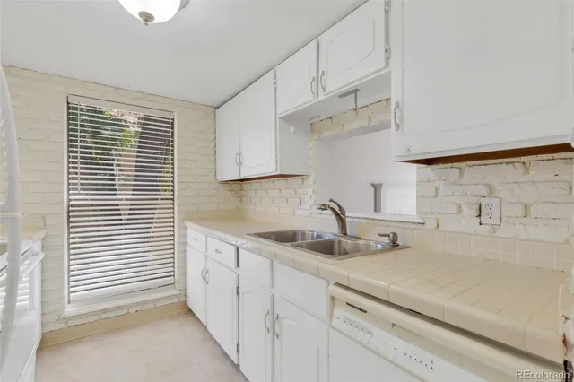a kitchen with a sink and cabinets