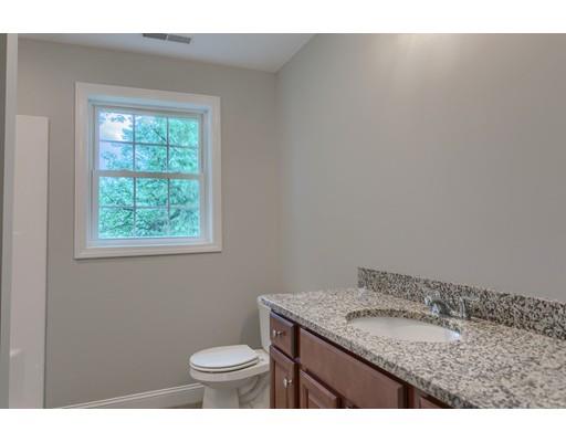 19 Goodale Street Haverhill, MA 01830 - Photo 24 of 30 a bathroom with a granite countertop sink and a mirror