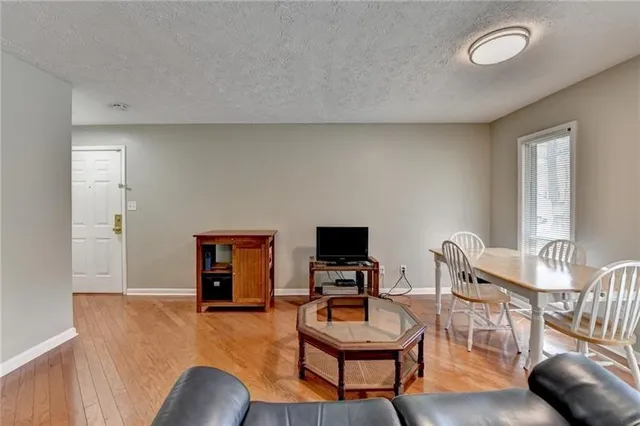 a bedroom with furniture and a wooden floor