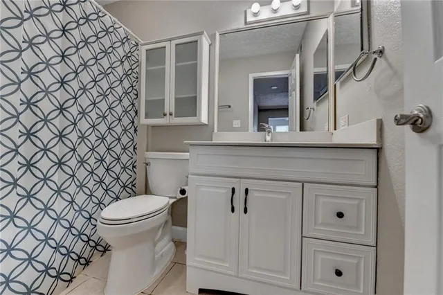 a bedroom with a bed and a window with the outer view