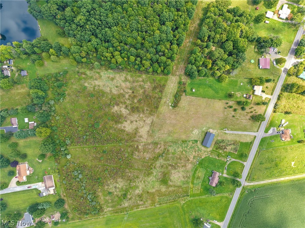 82 State Route Newton Falls, OH 44444 - Photo 24 of 30 Expansive land parcel with surrounding wooded areas and a body of water