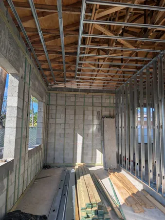 a backyard of a house with wooden floor