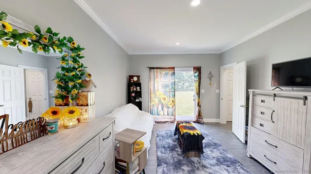 a bedroom with double bed and a window