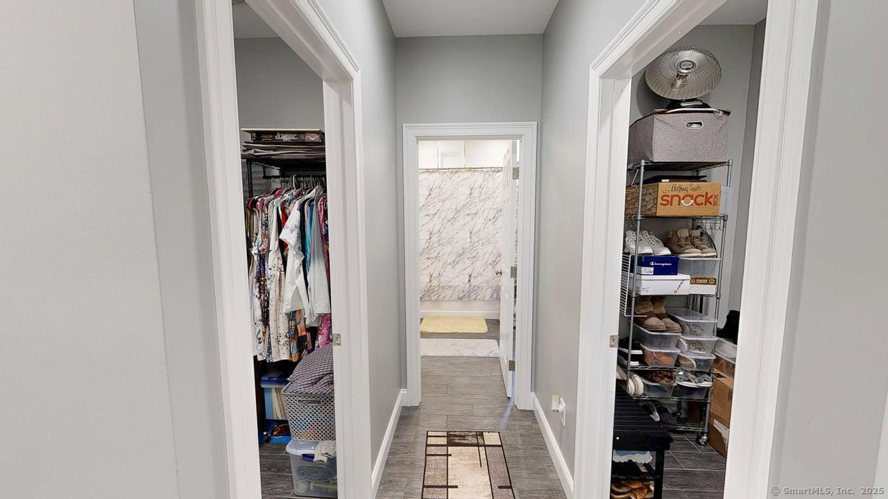 435 Maple Avenue Cheshire, CT 06410 - Photo 19 of 37 a view of walk in closet with clothes and shoes