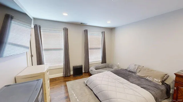 a bathroom with a tub and a glass door
