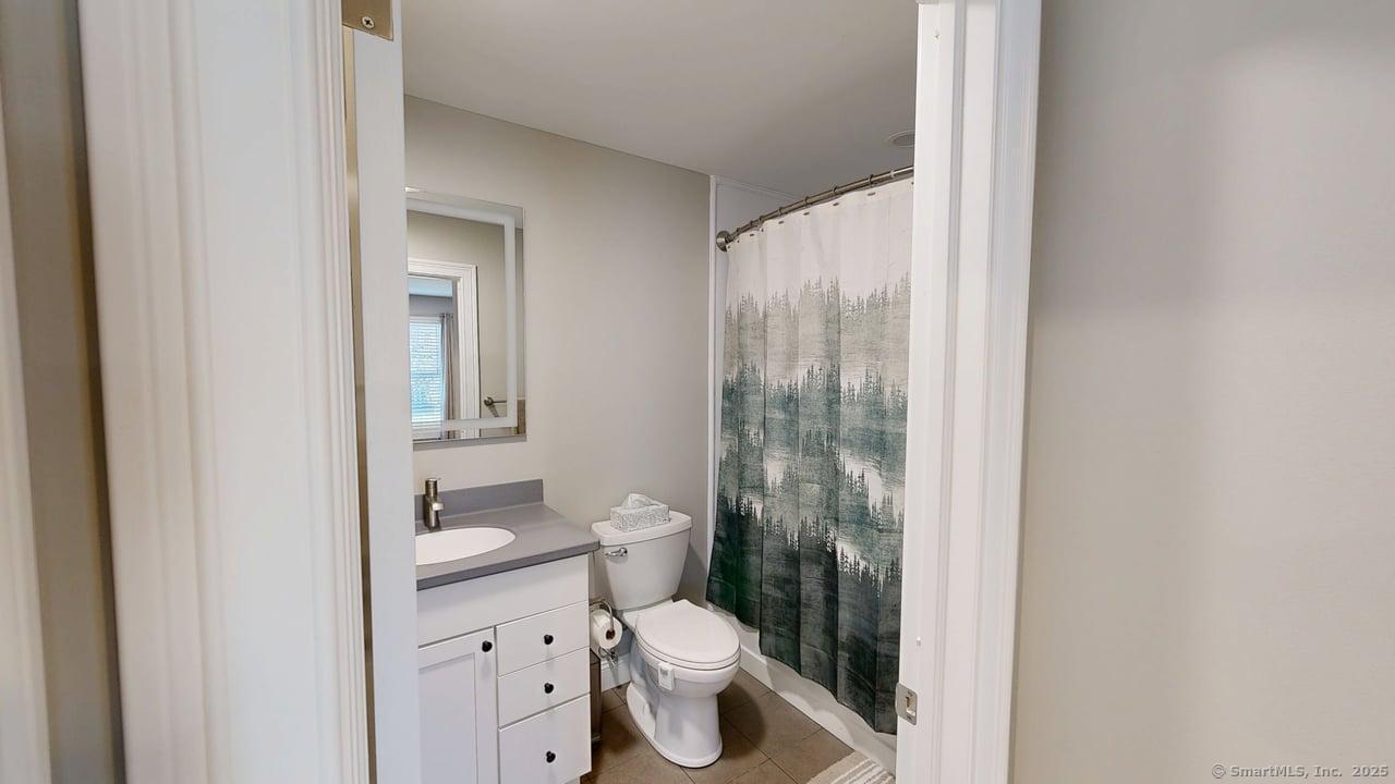 435 Maple Avenue Cheshire, CT 06410 - Photo 29 of 37 a bathroom with a toilet a sink and a shower
