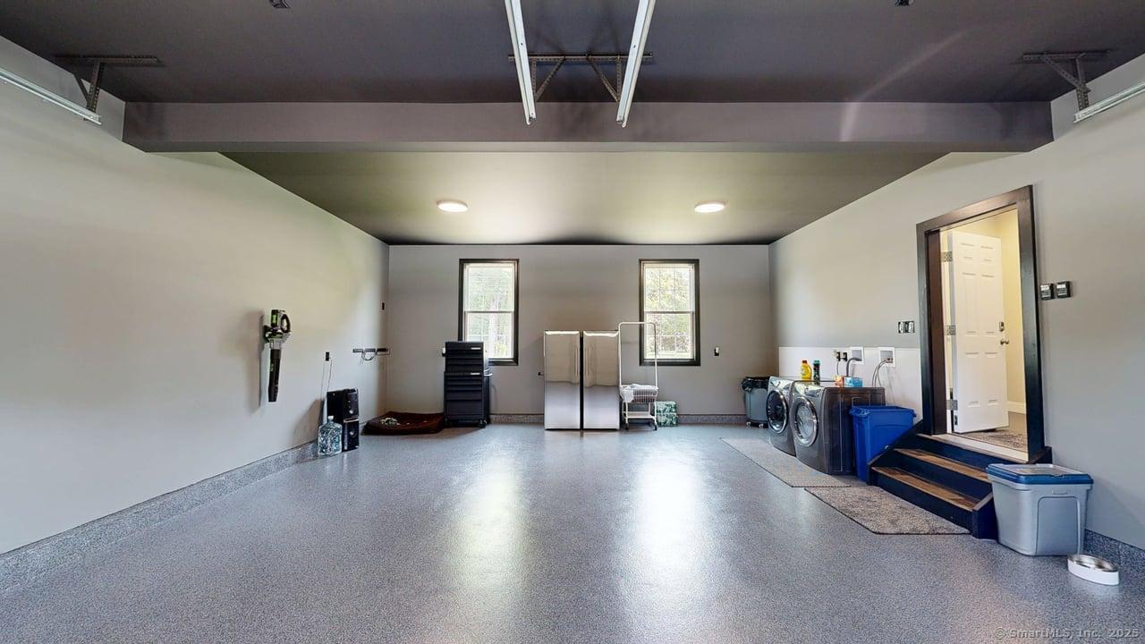 435 Maple Avenue Cheshire, CT 06410 - Photo 35 of 37 a living room with furniture gym equipment and a chandelier