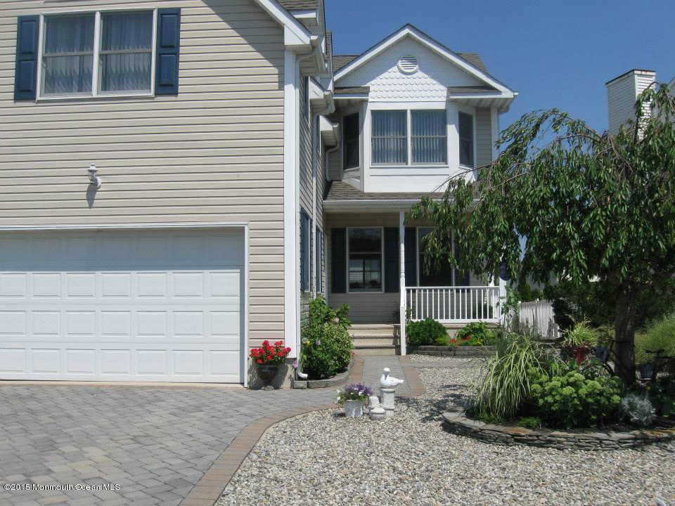 59 A Topsail Road Brick, NJ 08723 - Photo 1 of 18 a front view of a house with garden