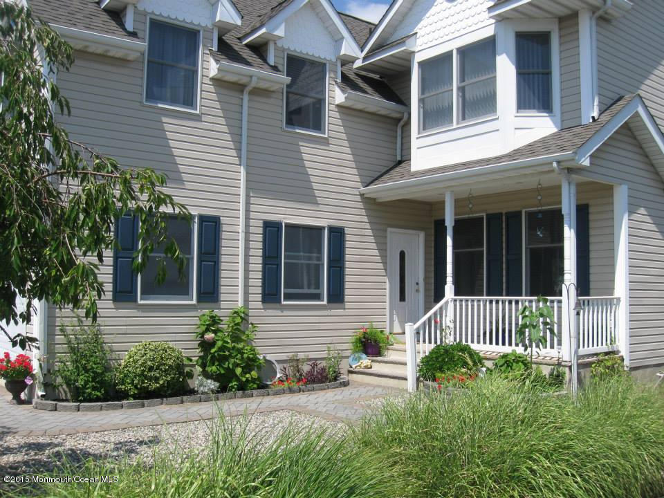 59 A Topsail Road Brick, NJ 08723 - Photo 2 of 18 a front view of a house with a garden