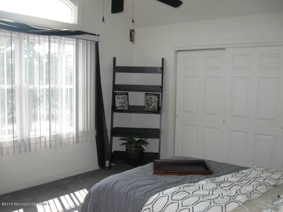 59 A Topsail Road Brick, NJ 08723 - Photo 11 of 18 a bedroom with a bed and a window
