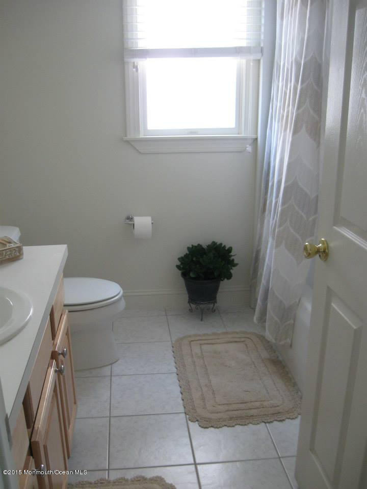 59 A Topsail Road Brick, NJ 08723 - Photo 14 of 18 a bathroom with a sink and a toilet