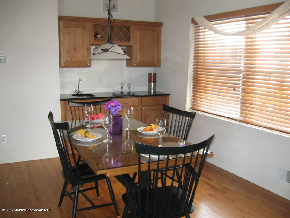 59 A Topsail Road Brick, NJ 08723 - Photo 5 of 18 a view of a dining room with furniture window and wooden floor