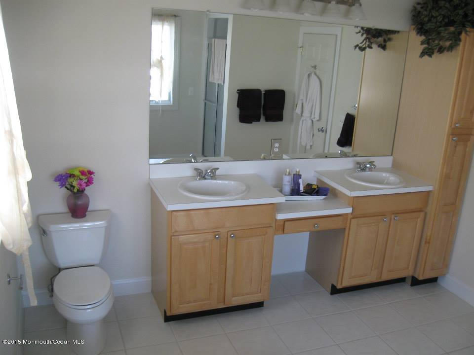 59 A Topsail Road Brick, NJ 08723 - Photo 9 of 18 a bathroom with a sink toilet and mirror