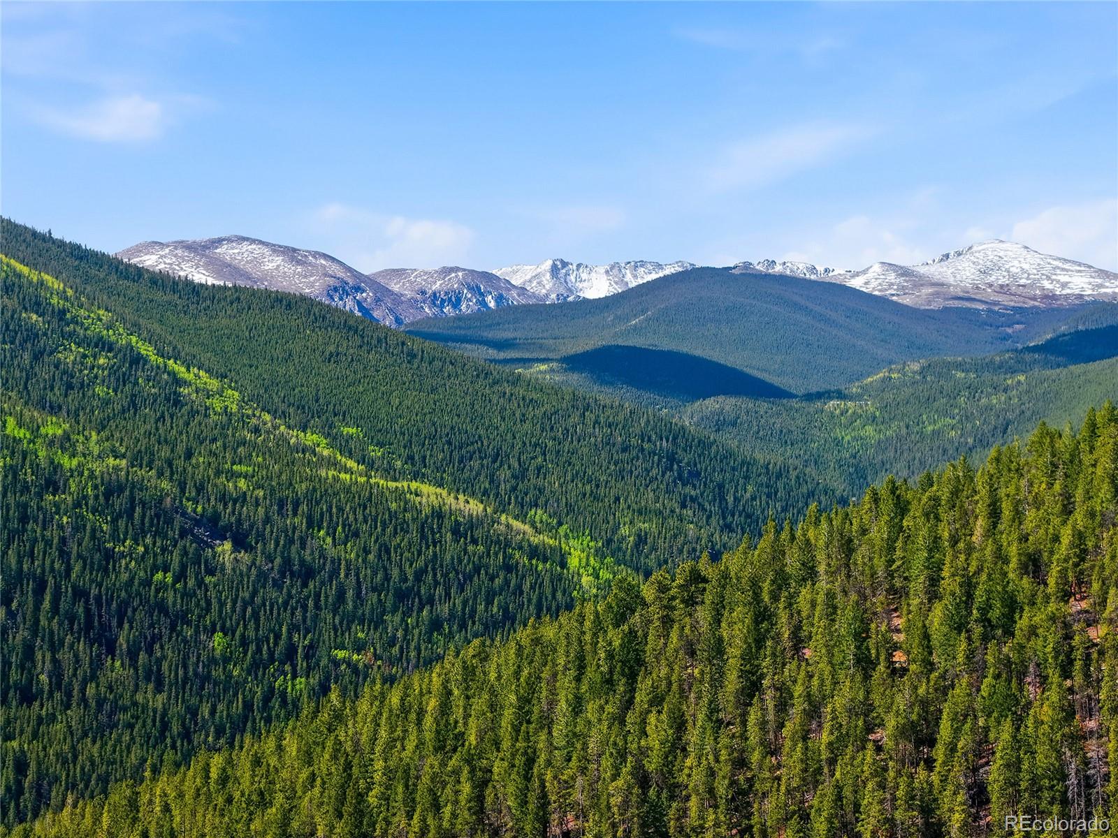600 Ute Creek Road Idaho Springs, CO 80452 - Photo 2 of 24 a view of a city with a mountain in the background