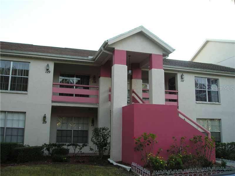 4515 Whitton Way, Unit 128 New Port Richey, FL 34653 - Photo 1 of 1 a front view of a house with a yard