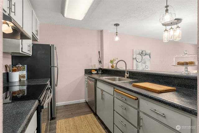 a kitchen with a sink and cabinets