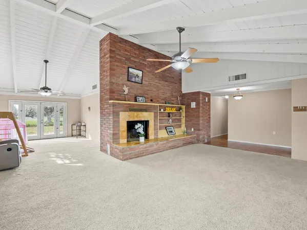 a view of a livingroom with furniture and windows