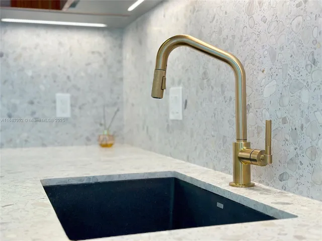 view of a utility room with door