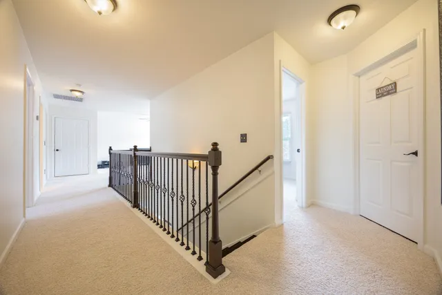 a view of a hallway with closet area