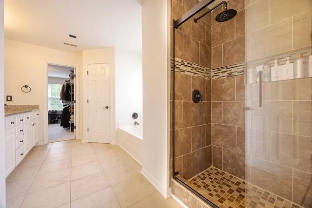 a bathroom with a glass shower door