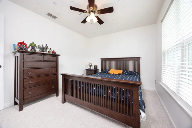 a view of hallway with a furniture and a window