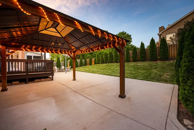 a view of yard with patio