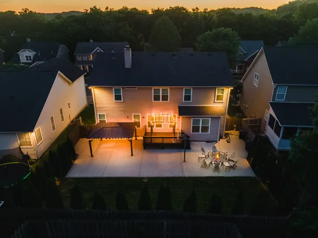 a aerial view of a house with pool lake view and mountain view