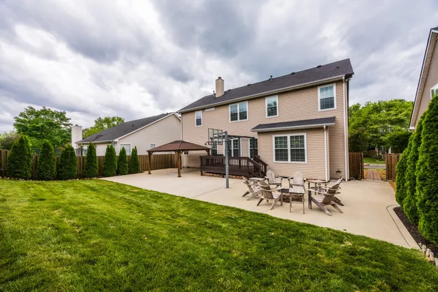 a front view of house with yard and seating area