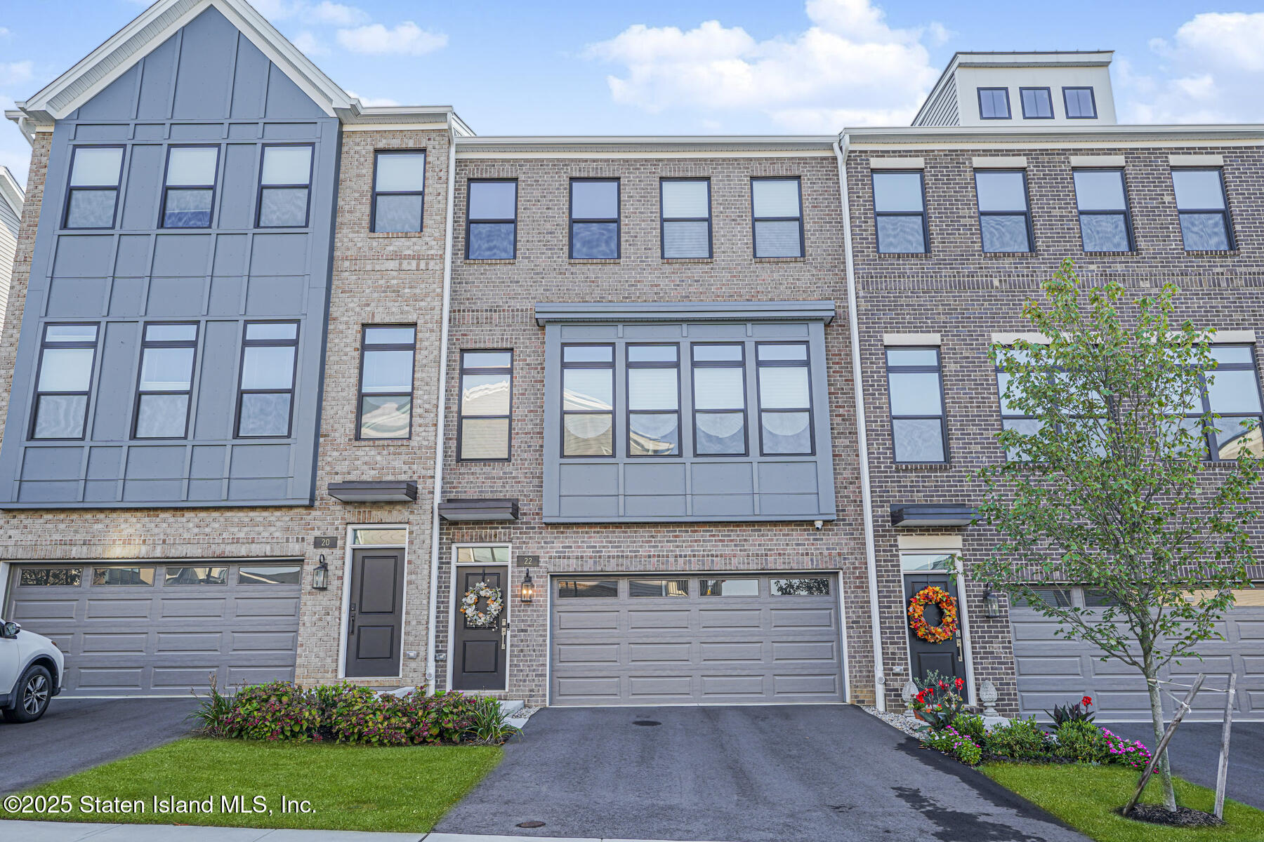 a front view of a building with garden