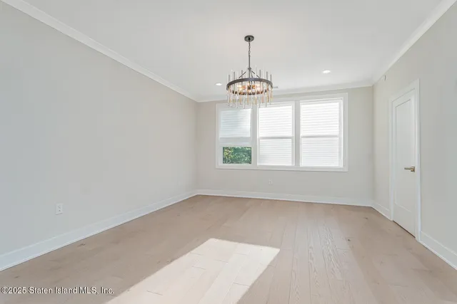 a bathroom with a sink a toilet a mirror and shower