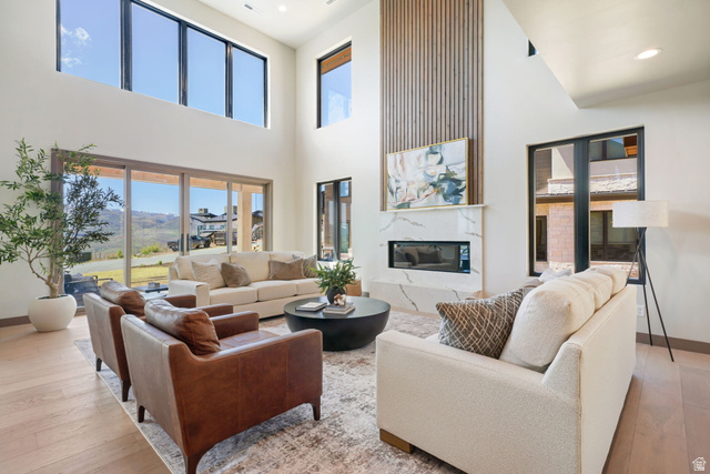 10646 North Reflection Ridge Hideout, UT 84036 - Photo 6 of 43 Spacious living area featuring a vaulted ceiling and wood-finish flooring