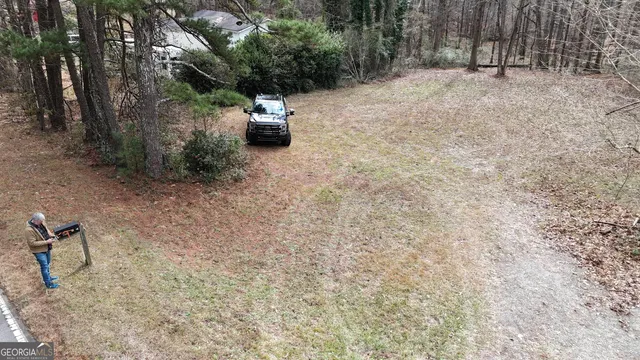 a backyard of a house with small trees