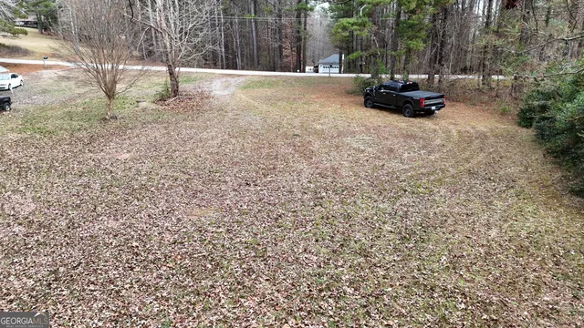 a backyard of a house with a trees