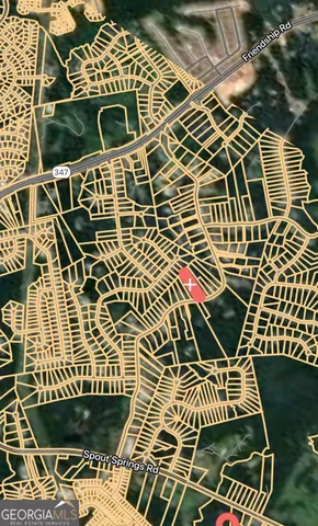 a backyard of a house with trees and outdoor seating