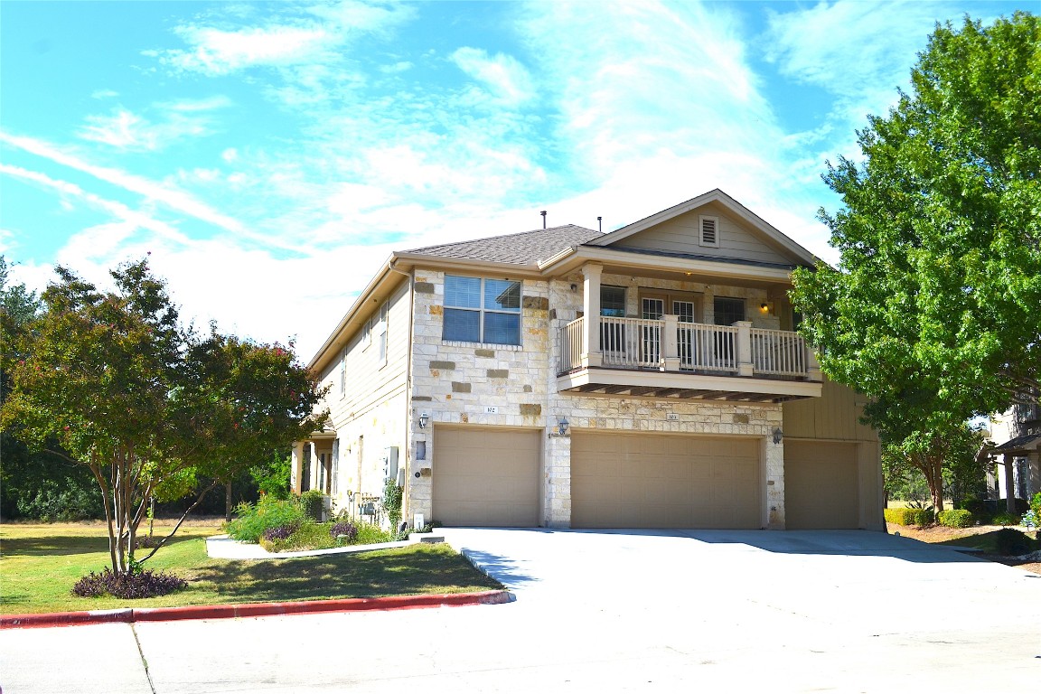 9201 Brodie Lane, Unit 101 Austin, TX 78748 - Photo 3 of 24 a front view of a house with a yard