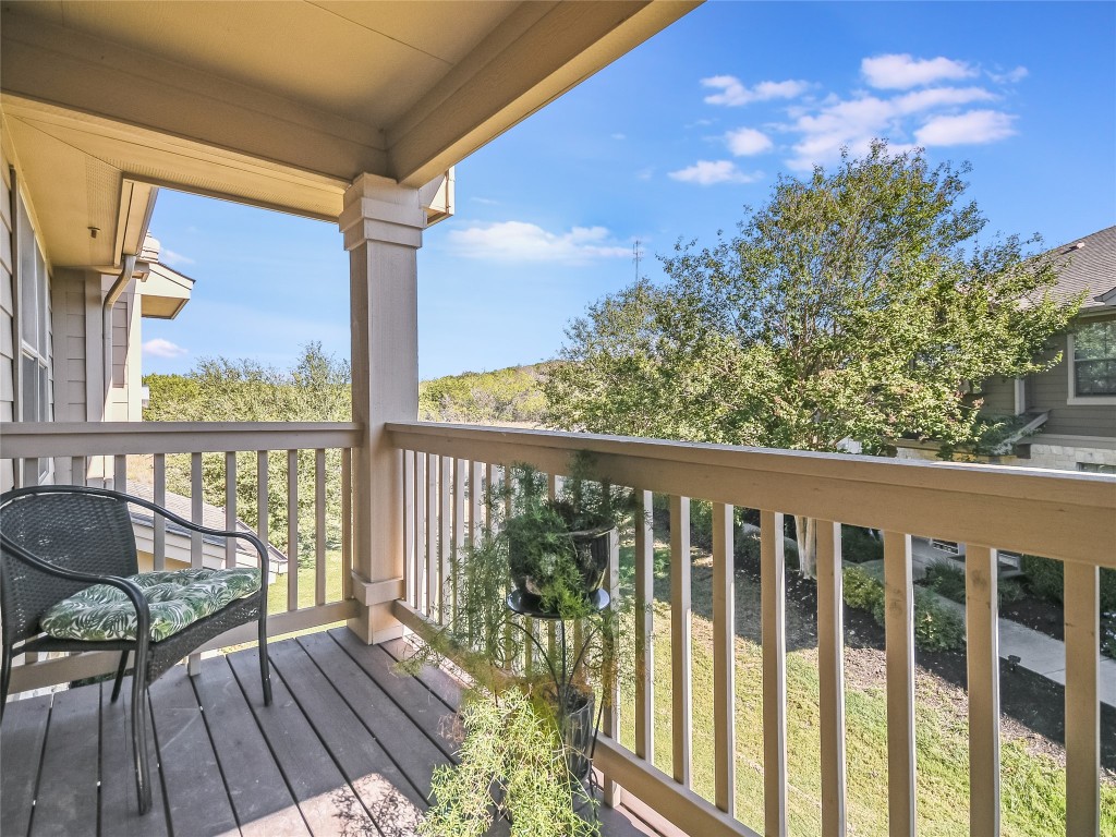 9201 Brodie Lane, Unit 101 Austin, TX 78748 - Photo 5 of 24 a view of a balcony with wooden floor