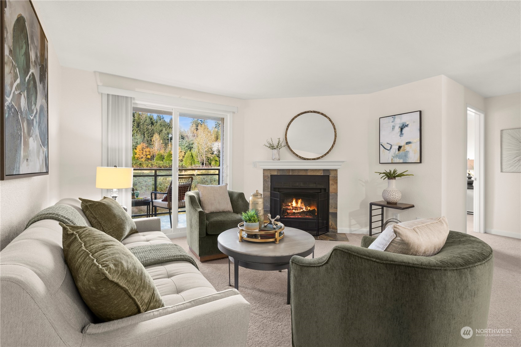 10822 East Riverside Drive, Unit A204 Bothell, WA 98011 - Photo 1 of 22 a living room with furniture a large window and a fireplace