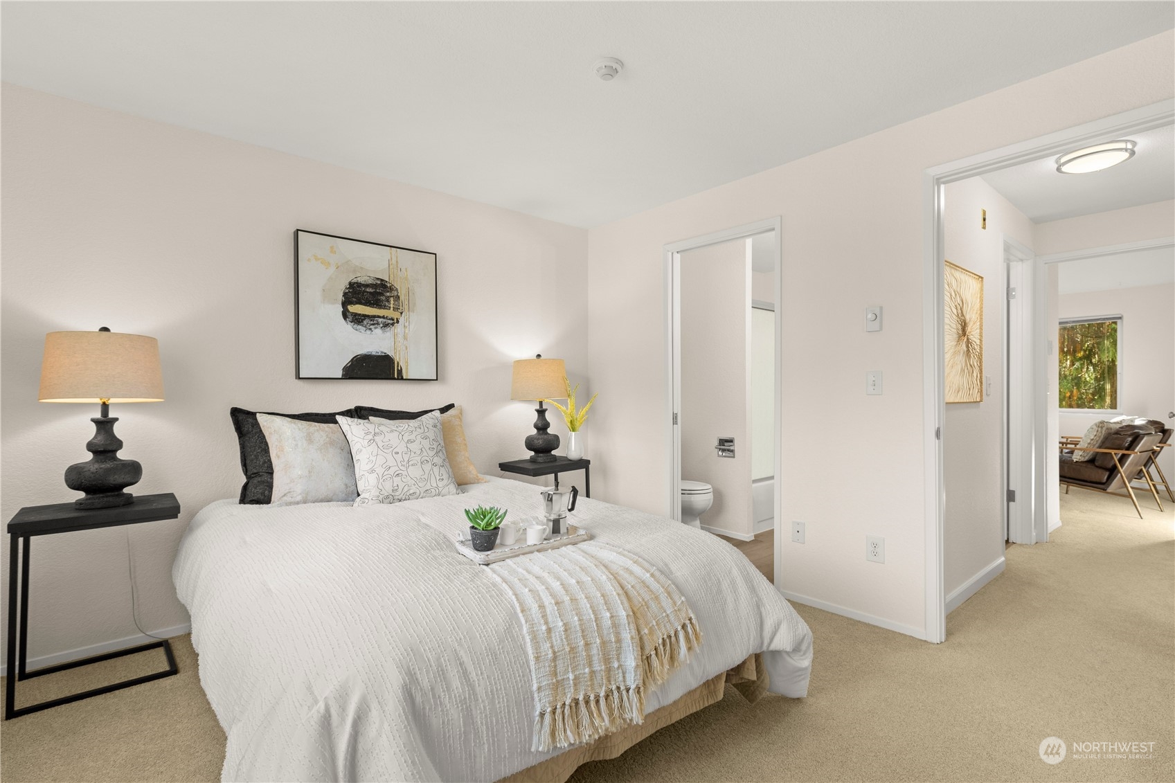 10822 East Riverside Drive, Unit A204 Bothell, WA 98011 - Photo 11 of 22 a bedroom with a bed and a lamp
