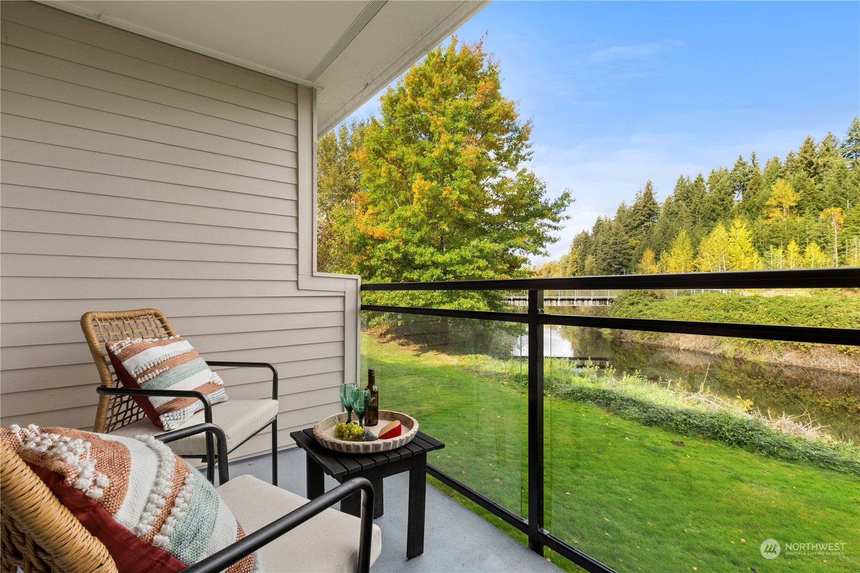 10822 East Riverside Drive, Unit A204 Bothell, WA 98011 - Photo 2 of 22 a view of a two chairs in the balcony