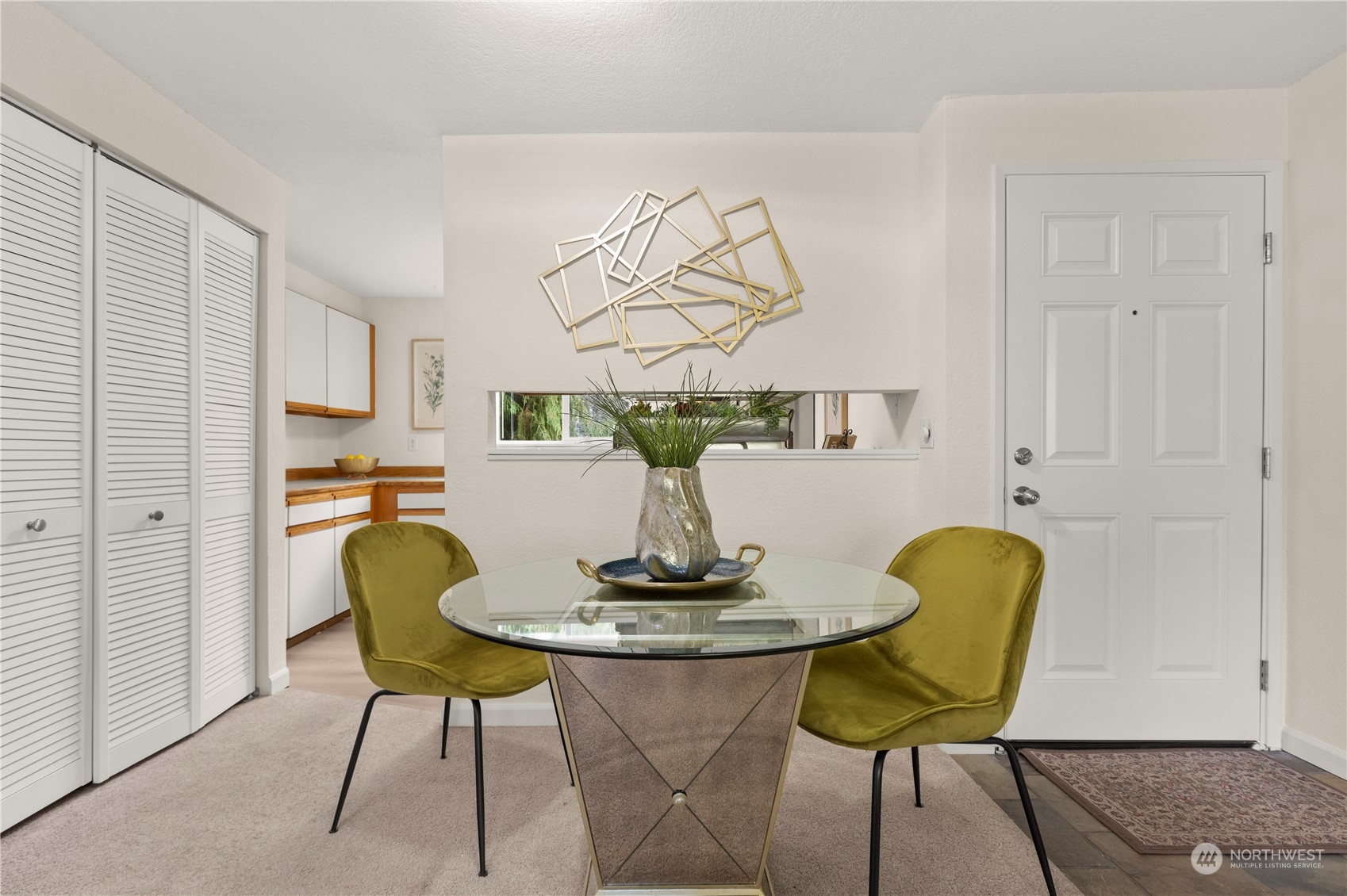 10822 East Riverside Drive, Unit A204 Bothell, WA 98011 - Photo 6 of 22 a view of kitchen with furniture and wooden floor