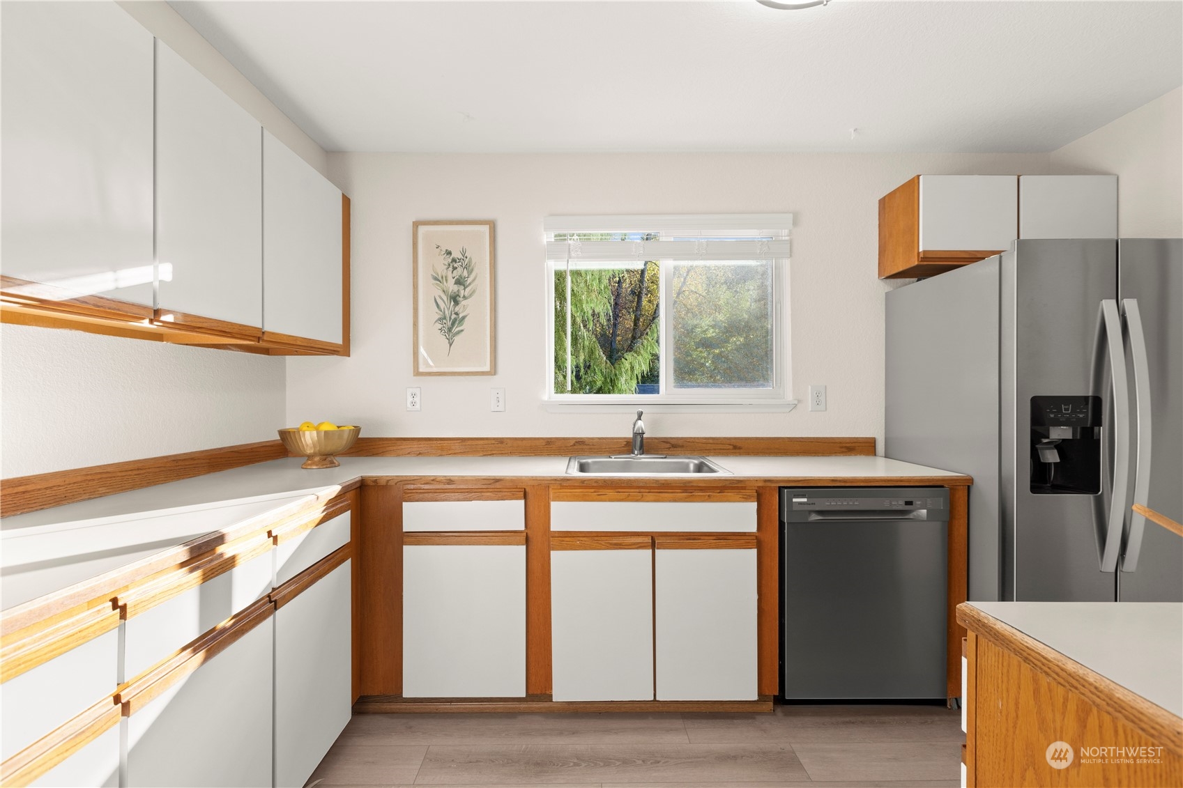 10822 East Riverside Drive, Unit A204 Bothell, WA 98011 - Photo 7 of 22 a kitchen with stainless steel appliances granite countertop a sink stove and refrigerator