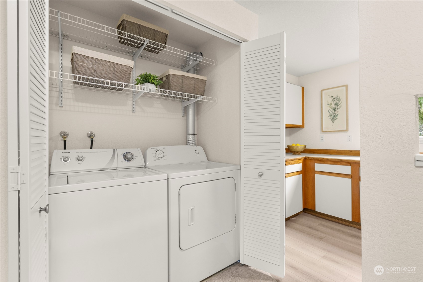 10822 East Riverside Drive, Unit A204 Bothell, WA 98011 - Photo 9 of 22 a utility room with dryer and washer