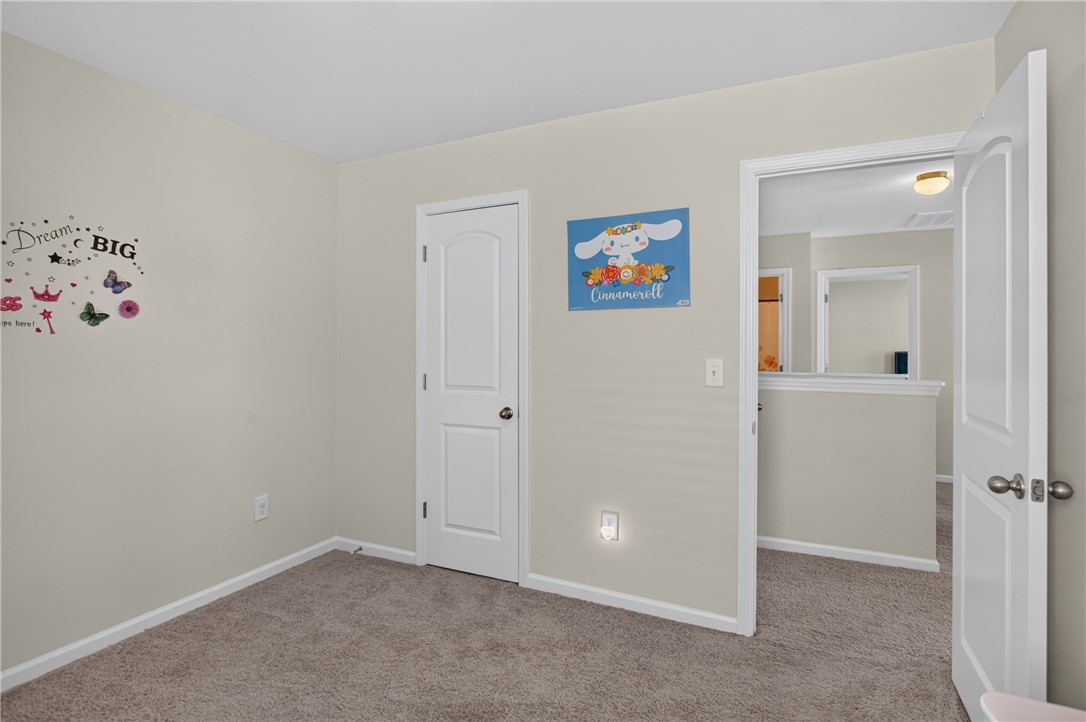 1081 Edenbrooke Circle Anderson, SC 29621 - Photo 37 of 46 A well-lit bedroom with soft carpet flooring and classic white trim throughout.