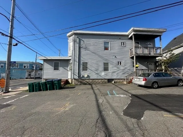a view of a car park in front of house