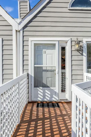 a view of a porch with wooden floor