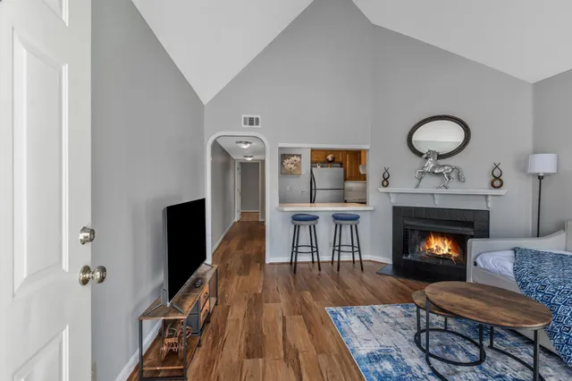 a living room with furniture and a fireplace